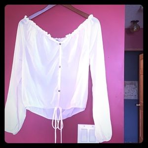 Long sleeve cream coloured blouse